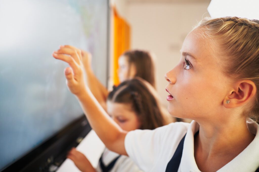 Inspired ICT Solutions Ltd - School students working with Interactive Whiteboard